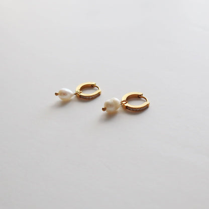 Close-up of Gold CZ Huggies with Pearl Drop showcasing the intricate details.